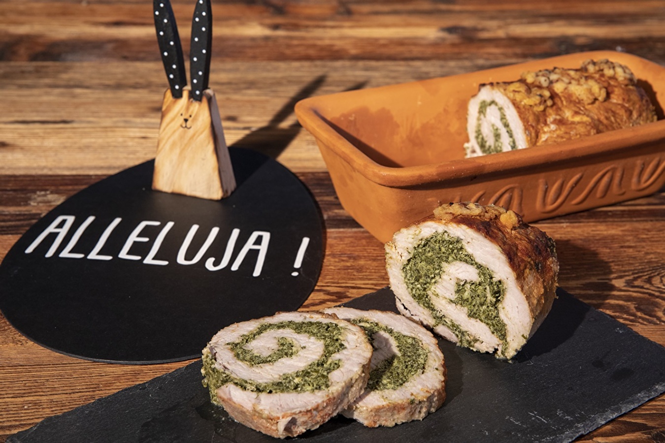 Pork loin roulade with spinach and feta in a Roman pot
